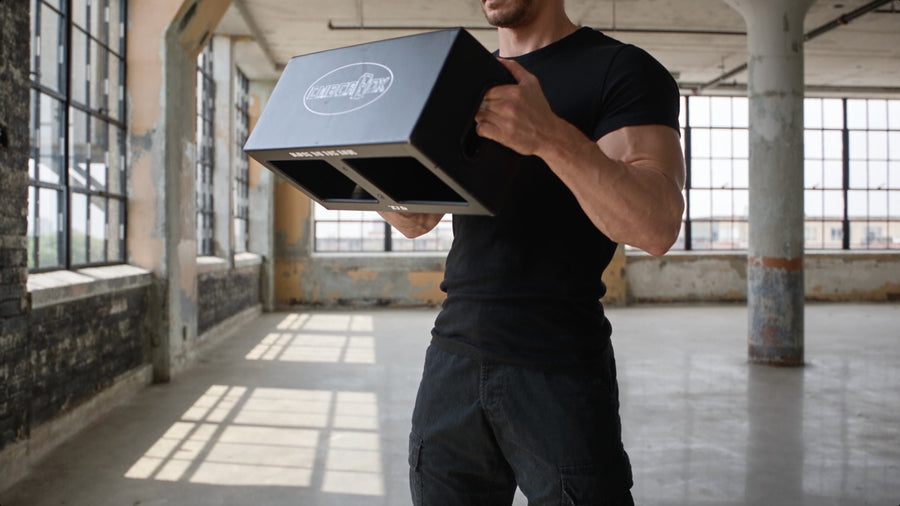 Holding an EmberBox at the shoulder, ready to press.