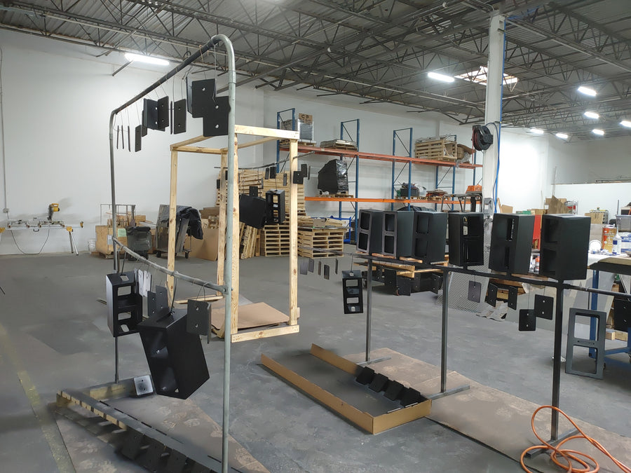 Finished shells and brackets curing on the racks.