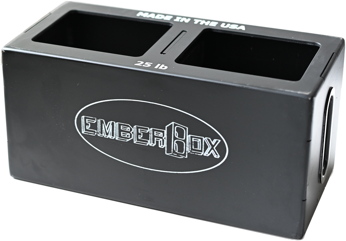 A 25 lb EmberBox: welded black steel, both hollow cores open on top, the EmberBox logo on its side.