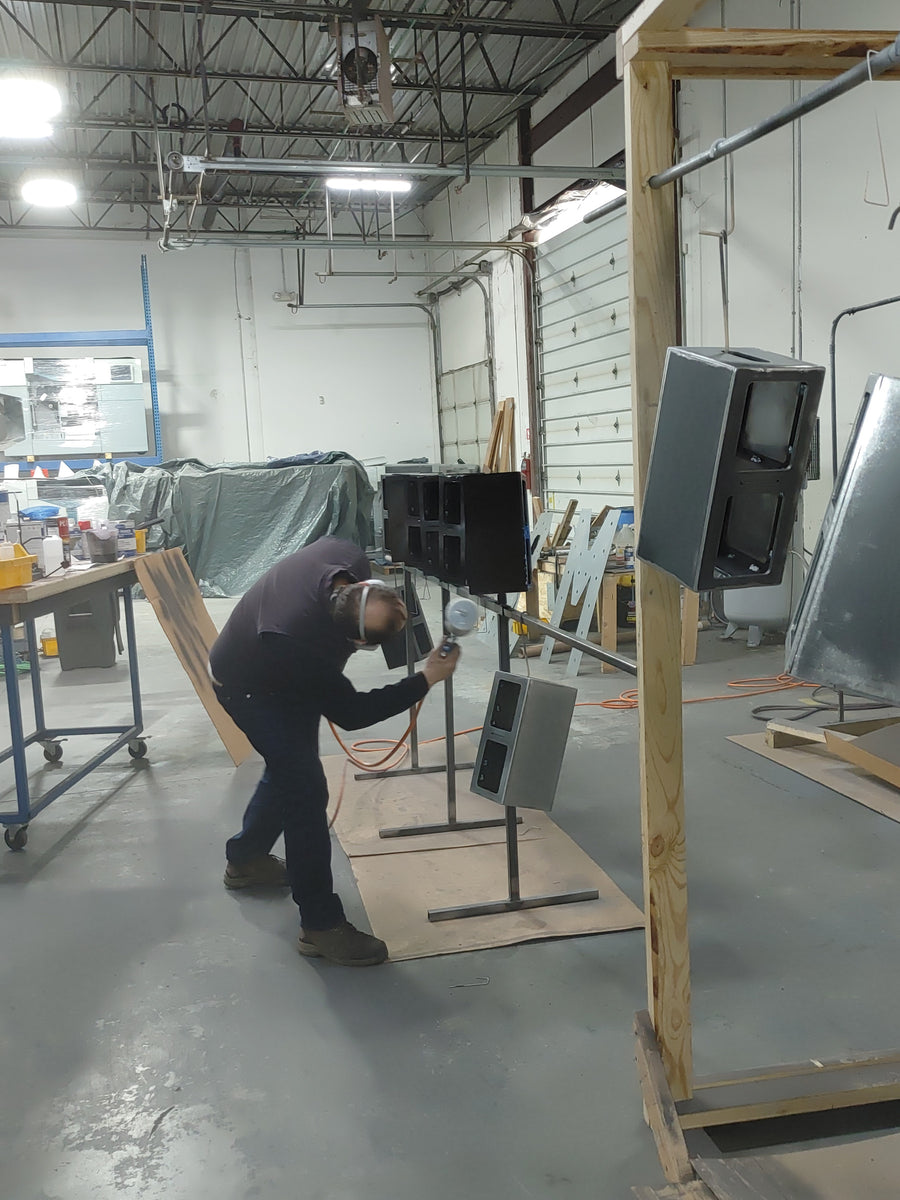 Finishing a shell on the paint line.